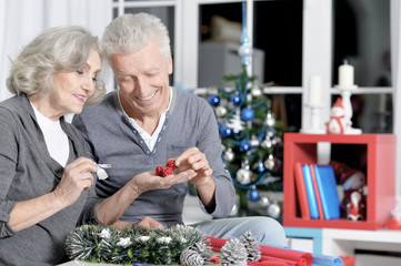 Poster - Happy senior couple preparing for Christmas at home