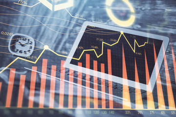 Financial market graph hologram and personal computer on background. Multi exposure. Concept of forex.