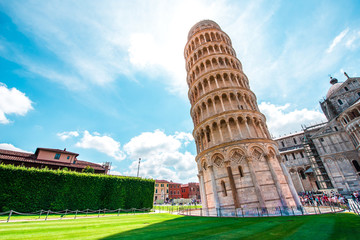 Picturesque landscape with church and famous sloping tower in Pisa, Italy. fascinating exotic amazing places.