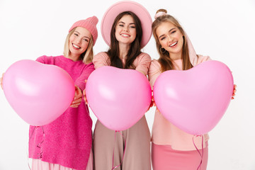 Poster - Image of three girls in pink clothes smiling and holding air balloons