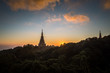 © chirawan_nt - Sunset between Noppamethanedol and Noppadol Phumsiri pagoda on Doi Inthanon national park. Doi Inthanon national park is the highest mountain of Thailand.