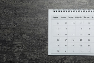 Sticker - Paper calendar on grey stone background, top view. Space for text