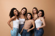 © New Africa - Group of women with different body types on beige background