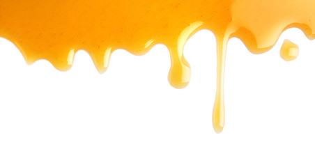 Fresh sweet honey flowing on white background