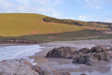 Wall Mural - Moreira beach in Muxia, Costa da Morte, Galicia, Spain. Waves Crashing Against the Rocks. This beach is one of the wildest spots on the hiking trail called 