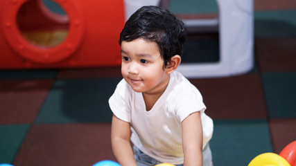 Wall Mural - Happy Little Asian baby boy 2 years old. child Healthy happy funny smiling face young toddler lovely kid concept. Asian kid laugh looking at camera portrait.                             