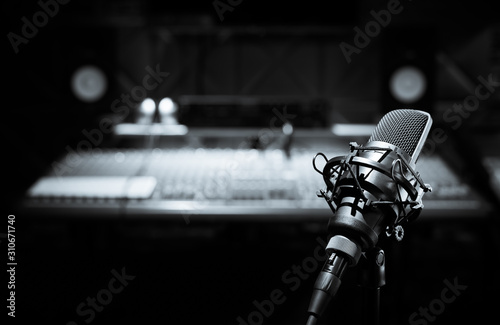 Fotomural black and white condenser microphone in recording studio