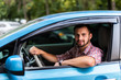 © F8  \ Suport Ukraine - Young handsome man drive his new electric car on the city road