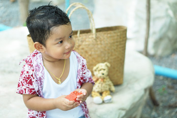 Wall Mural - Summer food. cheerful child eating juicy watermelon. Healthy eating seasonal fruits.do not Selective focus face photo.