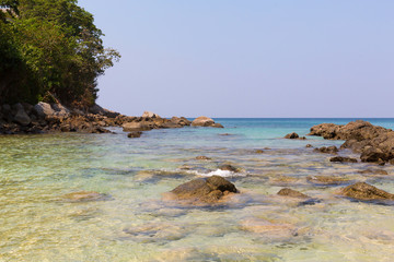 Sandy beach with boulders