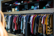 Assorted Casual Men Clothes On Shelves