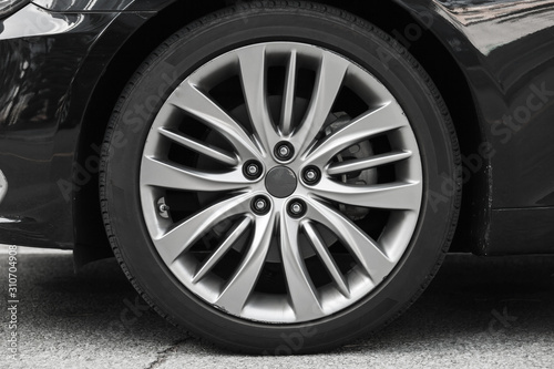 Cuadros en Lienzo Modern luxury car wheel on a light alloy disc,