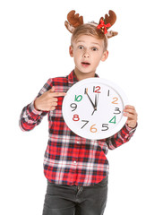 Sticker - Surprised little boy with clock on white background. Christmas countdown concept