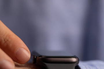 Close up of Businessman's hand looking at hand watch