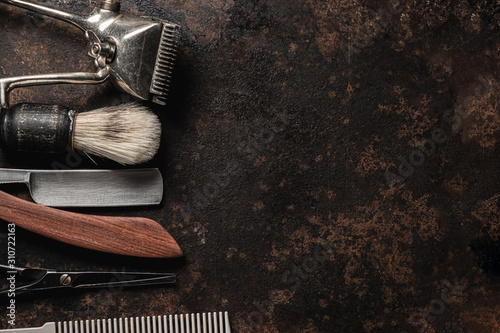 Cuadros en Lienzo vintage barber tools dangerous razor hairdressing scissors old manual clipper comb shaving brush