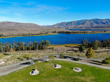 Aerial View Of Little Park In Front Of Otay Lake City Reservoir With Blue Sky And Mountain On The Background, Chula Vista, California. USA