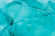 © Julie Rideout/Stocksy - Turquoise blue alcohol Ink background