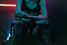 Portrait Of Young Female Woman In Room With Neon Lights
