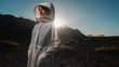 © brkati krokodil/Stocksy - Woman Wearing Futuristic White Coat Outdoors