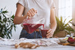© Jill Chen/Stocksy - Woman making beetroot juice in kitchen