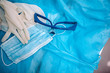 © velimir - gloves mask, glasses and uniform of the surgeon after surgery.