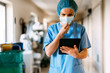© Santi Nunez/Stocksy - Medical staff using device