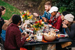 © CWP, LLC/Stocksy - Group of friends enjoy fall dinner party