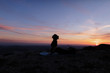 © Javier Pardina/Stocksy - Woman Doing Yoga on Mountain Cliff