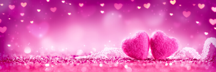 Wall Mural - two soft pink hearts with lace on pink glitter background - valentine's day concept