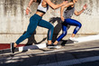 © Santi Nunez/Stocksy - Professional Runners in the street
