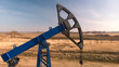 © Danil Nevsky/Stocksy - Pumpjack against dry field