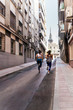 © Santi Nunez/Stocksy - Professional Runners in the street