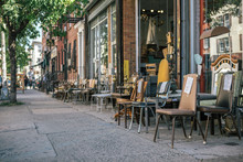 Street View Of Commercial Street In Williamsburg Brooklyn With Old Chair Of Junk Shop On Sidewalk