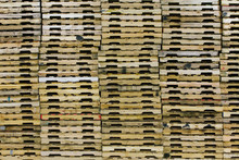 Wooden Pallets Stacked In Warehouse