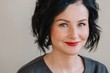 © Liliya Rodnikova/Stocksy - Headshot portrait of stylish mature happy woman