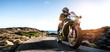 © AA+W - motorbike on the coastal road riding. having fun driving the empty highway on a motorcycle tour journey