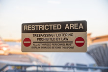 Restricted Area Sign On Airport Door