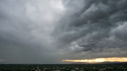 Wall Mural - Dark rain storm over the city of Orem in Utah..
