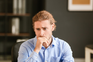 Wall Mural - Depressed businessman working in office