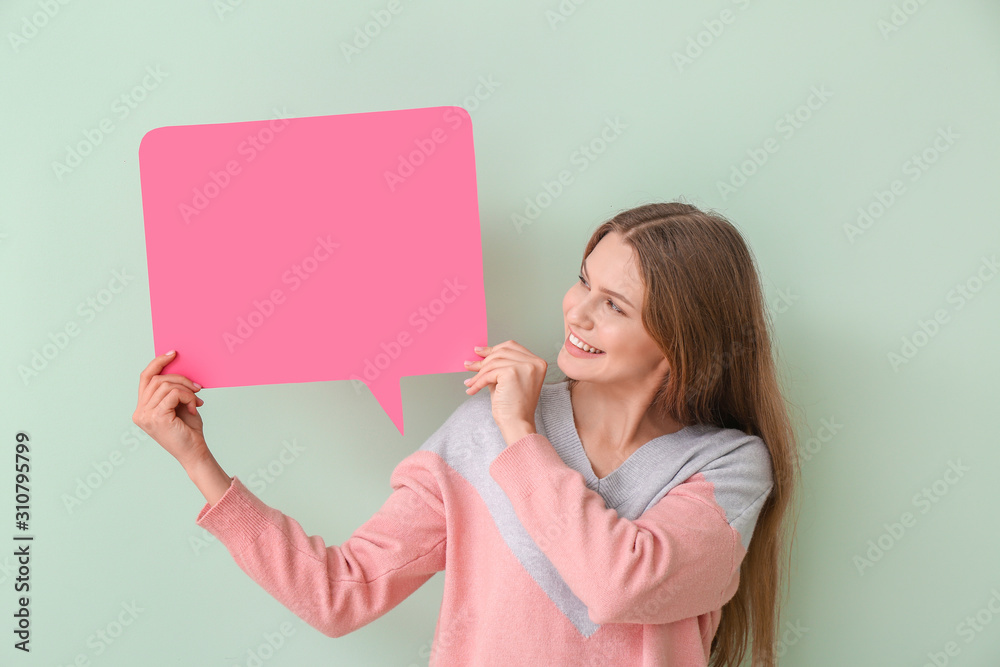 Young woman with blank speech bubble on color background