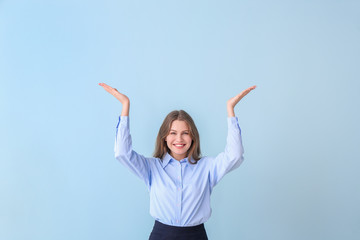 Sticker - Young businesswoman on color background