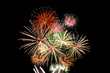 © Maicyber - Fireworks light up in the night sky, dazzling scene.