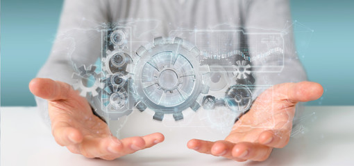 Poster - Man holding a technology gear wheel interface3d rendering