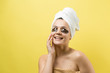 © Mountains Hunter - Young beautiful girl in a white towel on his head wears collagen gel patches under her eyes. Mask under eyes treatment face.