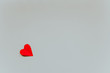 Little red paper heart in the corner on the light grey background. Saint Valentine s Day concept. 