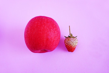 Poster - Strawberry and apple isolated on the pink scene or pink background