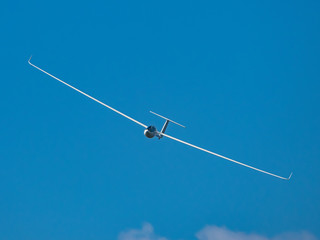 Wall Mural - Glider plane flying in the clouds