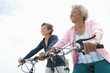 © moodboard - Senior Female Friends Riding Bicycle