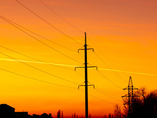 electric pole with wires on a sunset background