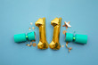Christmas countdown. Gold number 11 with festive cristmas cracker decorations